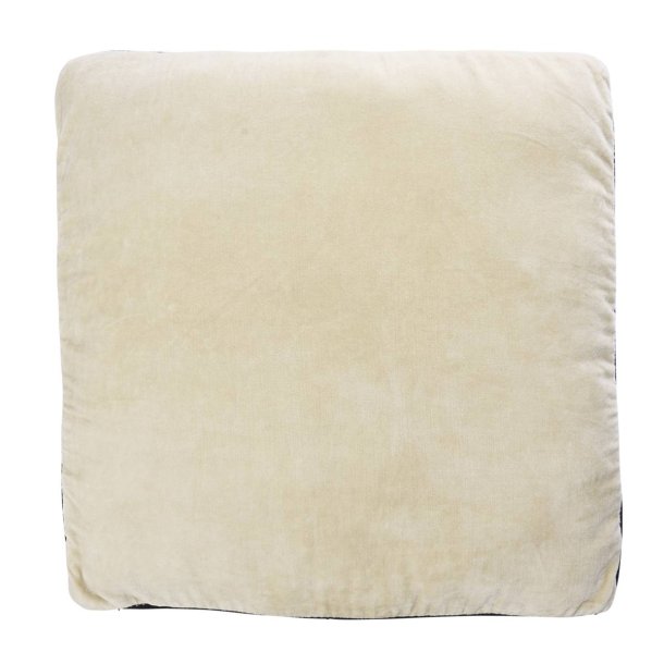 Bl�d siddepude i gr� og sort bomuld og velour placeret p� stol i moderne boligindretning