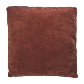Siddepude i burnt red og sort velour og bomuld placeret p� stol med moderne og hyggelig boligindretning